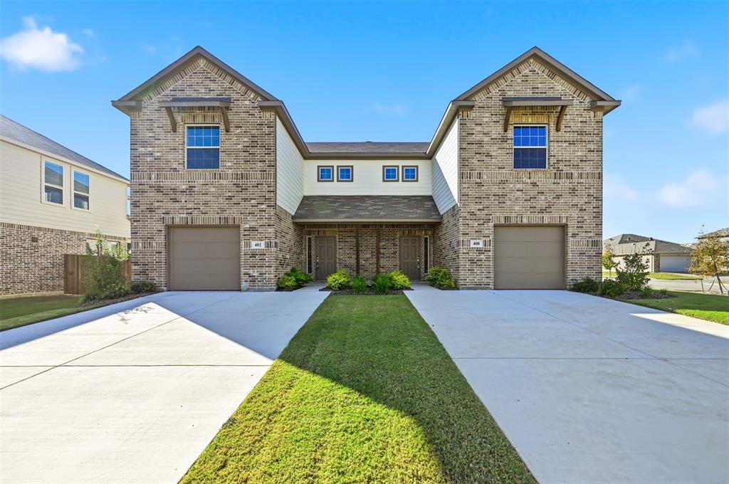 400 Wrangler Lane, Unit 400 Denton, TX 76209 - Photo 1 of 18 a front view of a house with yard