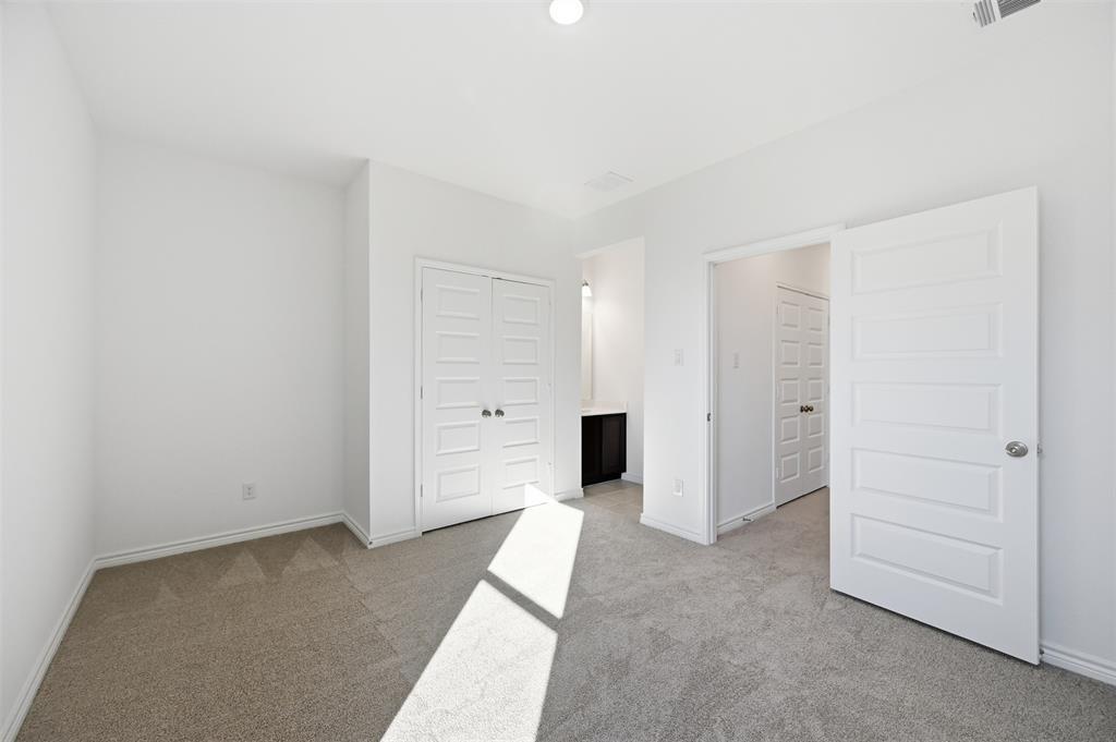 400 Wrangler Lane, Unit 400 Denton, TX 76209 - Photo 13 of 18 an empty room with closet area