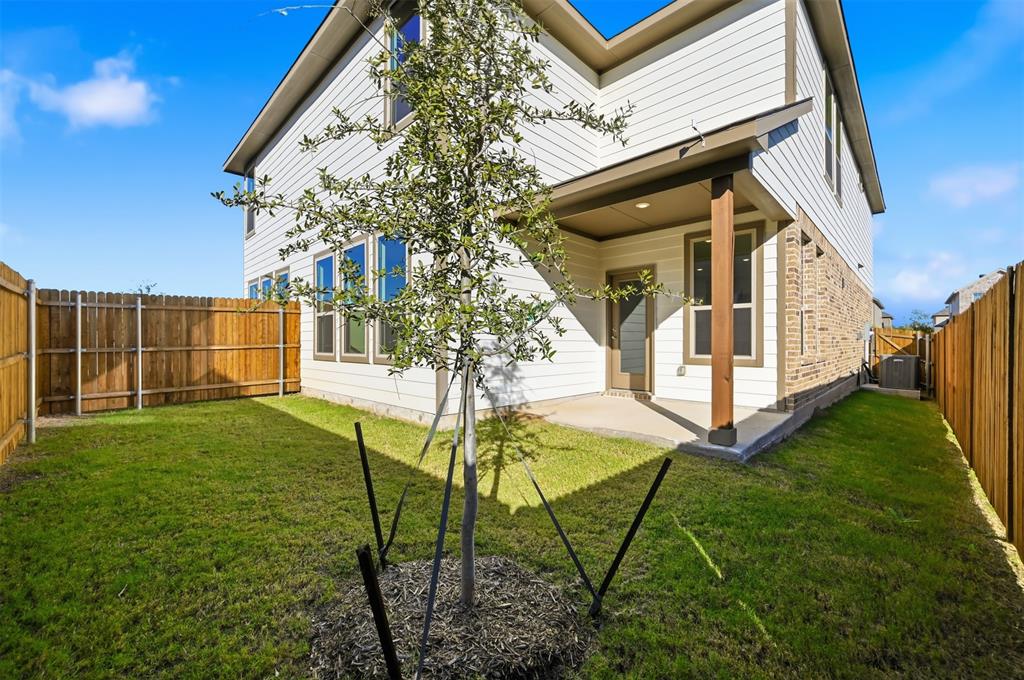 400 Wrangler Lane, Unit 400 Denton, TX 76209 - Photo 14 of 18 a view of an house with backyard and sitting area