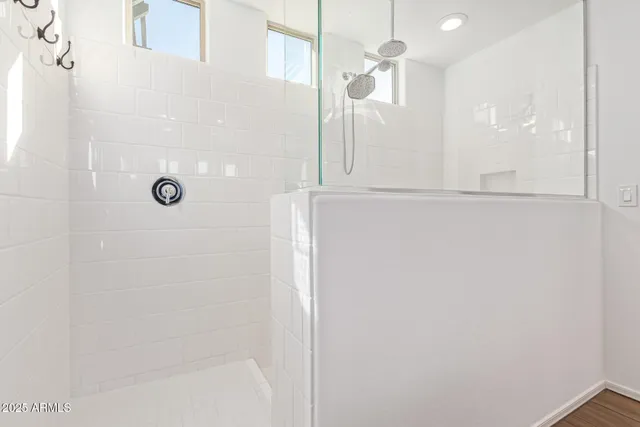 a view of a patio with a table and chairs under an umbrella