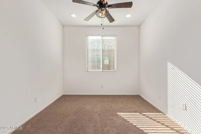 a view of a lush green hillside and houses