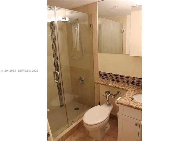 1500 Bay Road, Unit 318S Miami Beach, FL 33139 - Photo 4 of 6 a bathroom with a toilet and a shower
