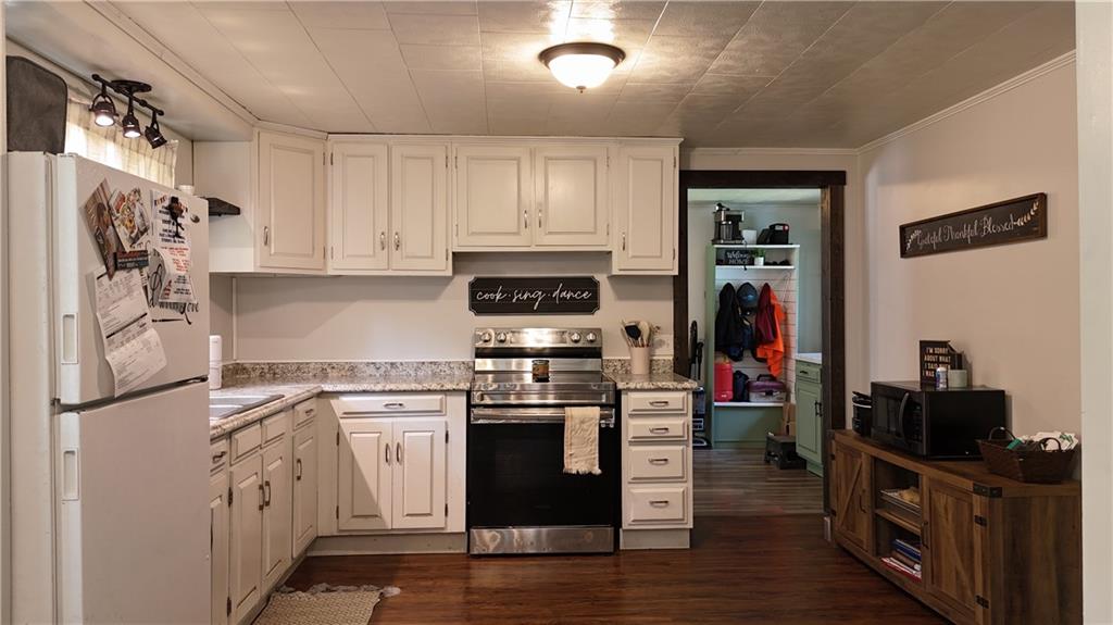 29558 Drake Hill Road Cochranton, PA 16314 - Photo 8 of 18 a kitchen with stainless steel appliances granite countertop a stove and a refrigerator