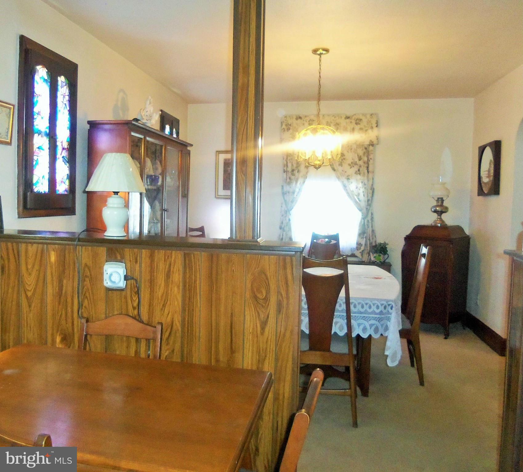 5574 Ashbourne Road Baltimore, MD 21227 - Photo 13 of 29 a room with table chairs and entryway