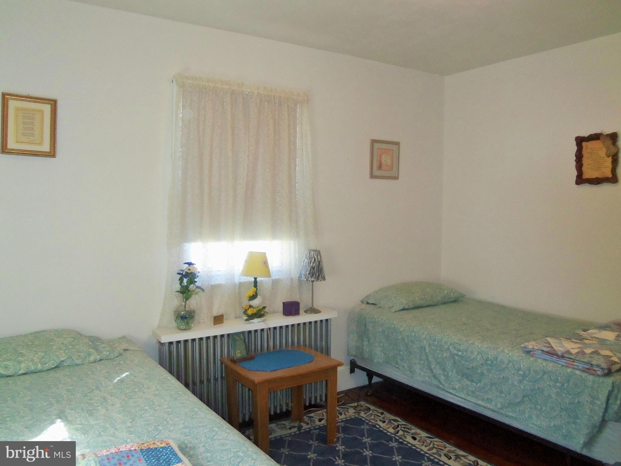 5574 Ashbourne Road Baltimore, MD 21227 - Photo 20 of 29 a bedroom with a bed and a window