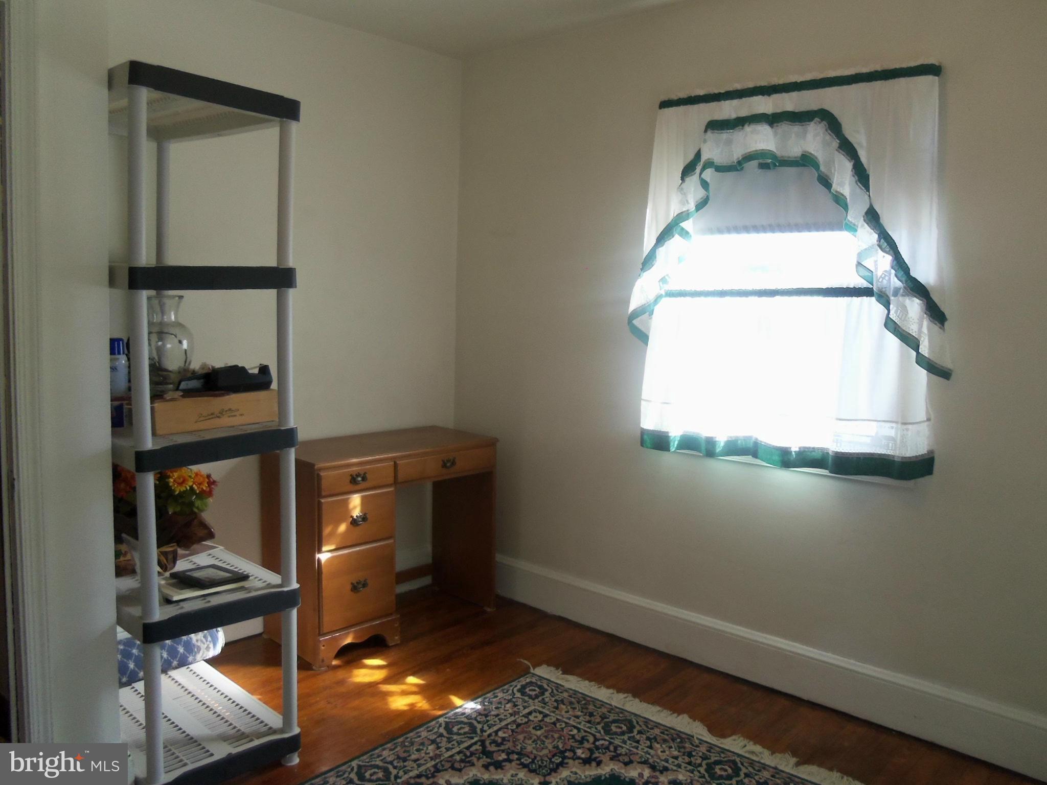5574 Ashbourne Road Baltimore, MD 21227 - Photo 23 of 29 a view of entryway with wooden floor