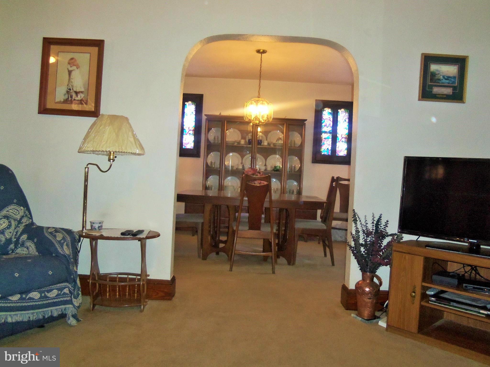 5574 Ashbourne Road Baltimore, MD 21227 - Photo 10 of 29 a living room with furniture and a flat screen tv