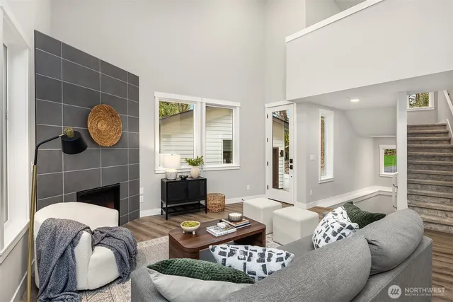 a living room with furniture and a fireplace