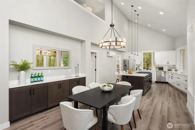 a large kitchen with a table and chairs