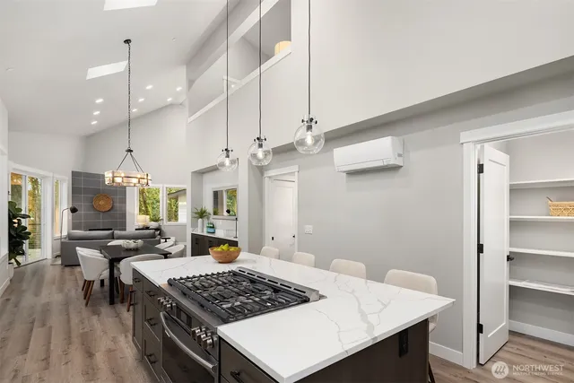 a large kitchen with a table and chairs in it