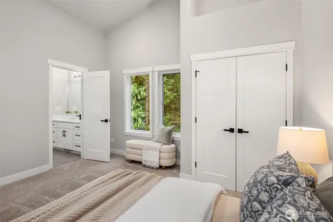 a view of a room with lounge chair and wooden floor