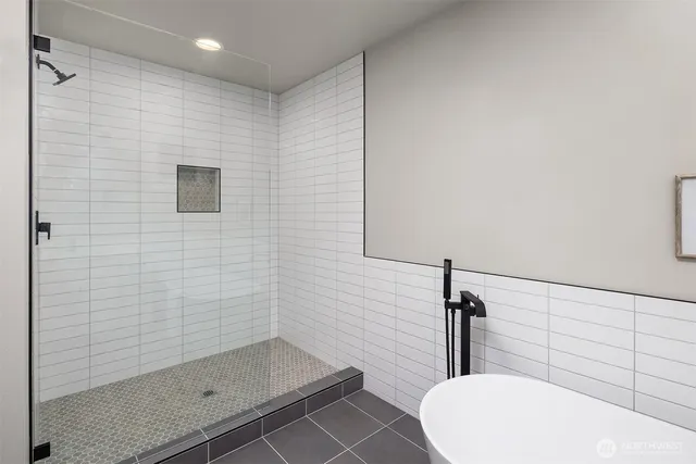 a bathroom with a sink and shower