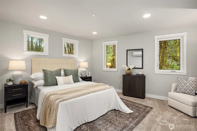 a bedroom with bed and a couch