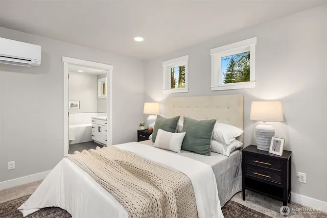 a bedroom with a bed and a lamp