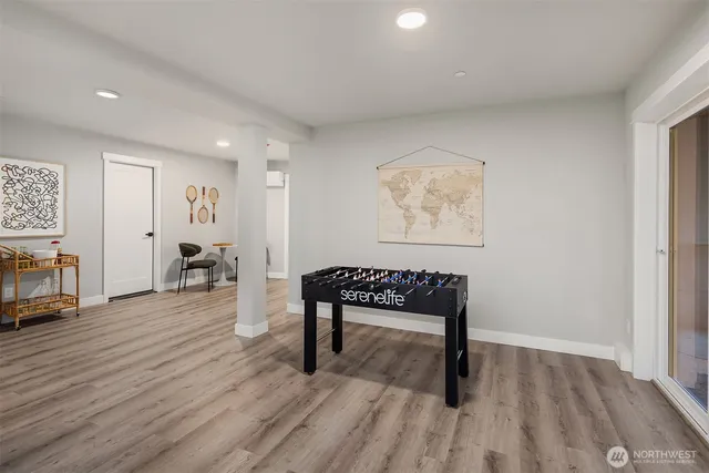 a view of a room with lounge chair and wooden floor