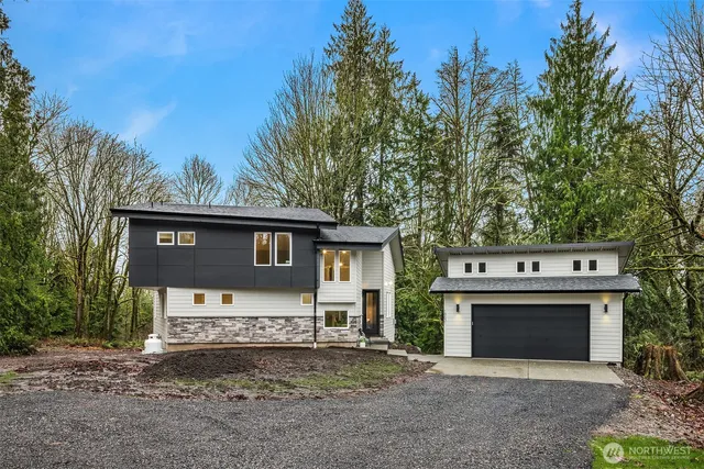 a view of house with a trees in the background