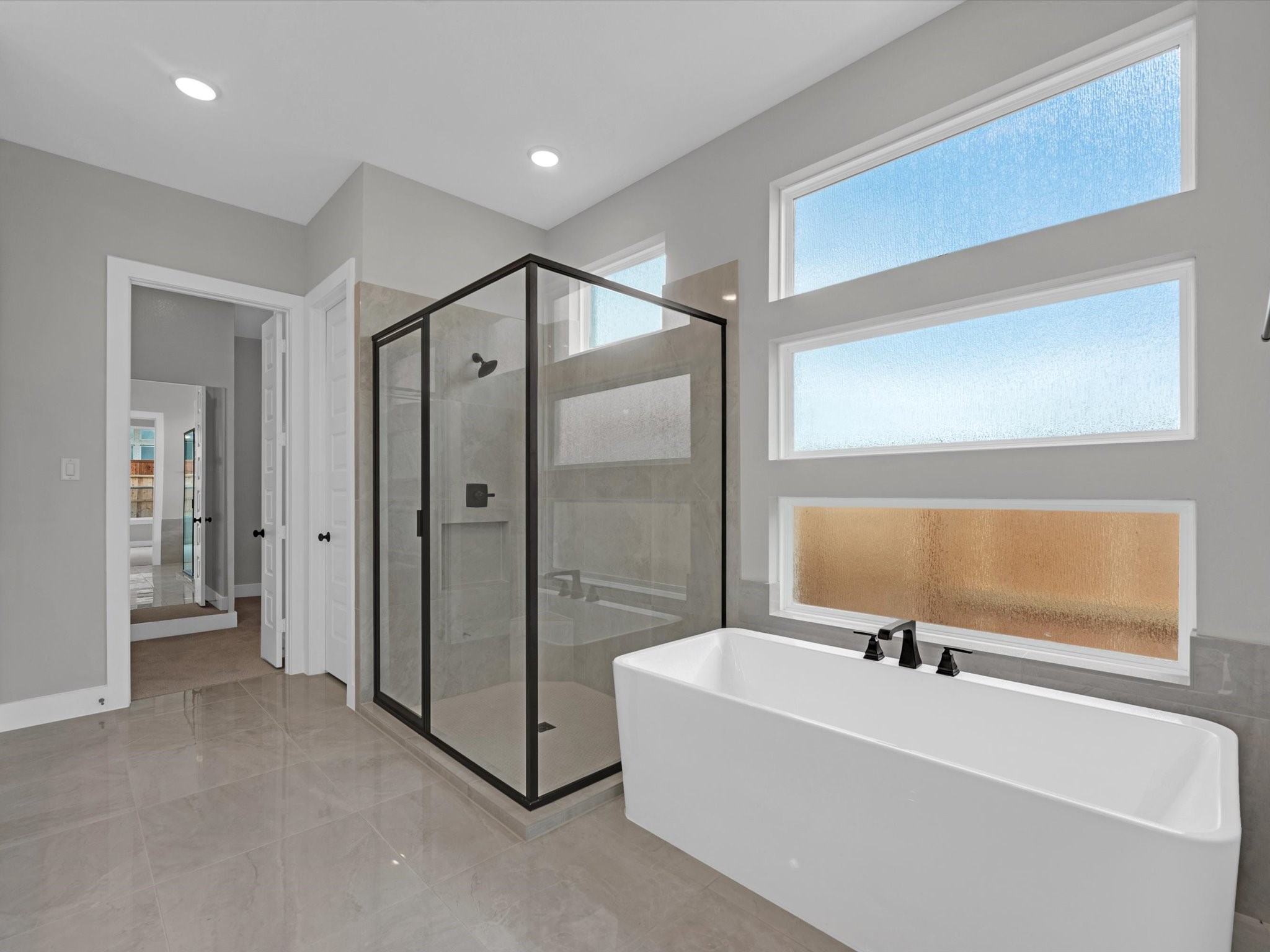8123 Sunny Rdg Drive Fulshear, TX 77441 - Photo 14 of 42 a bathroom with a bathtub and a shower