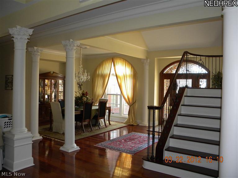 12480 Falcon Ridge Road Chesterland, OH 44026 - Photo 7 of 16 View of ornately designed pillars featuring open dining room also with brazilian cherry flooring. First floor has 10' ceilings thruout