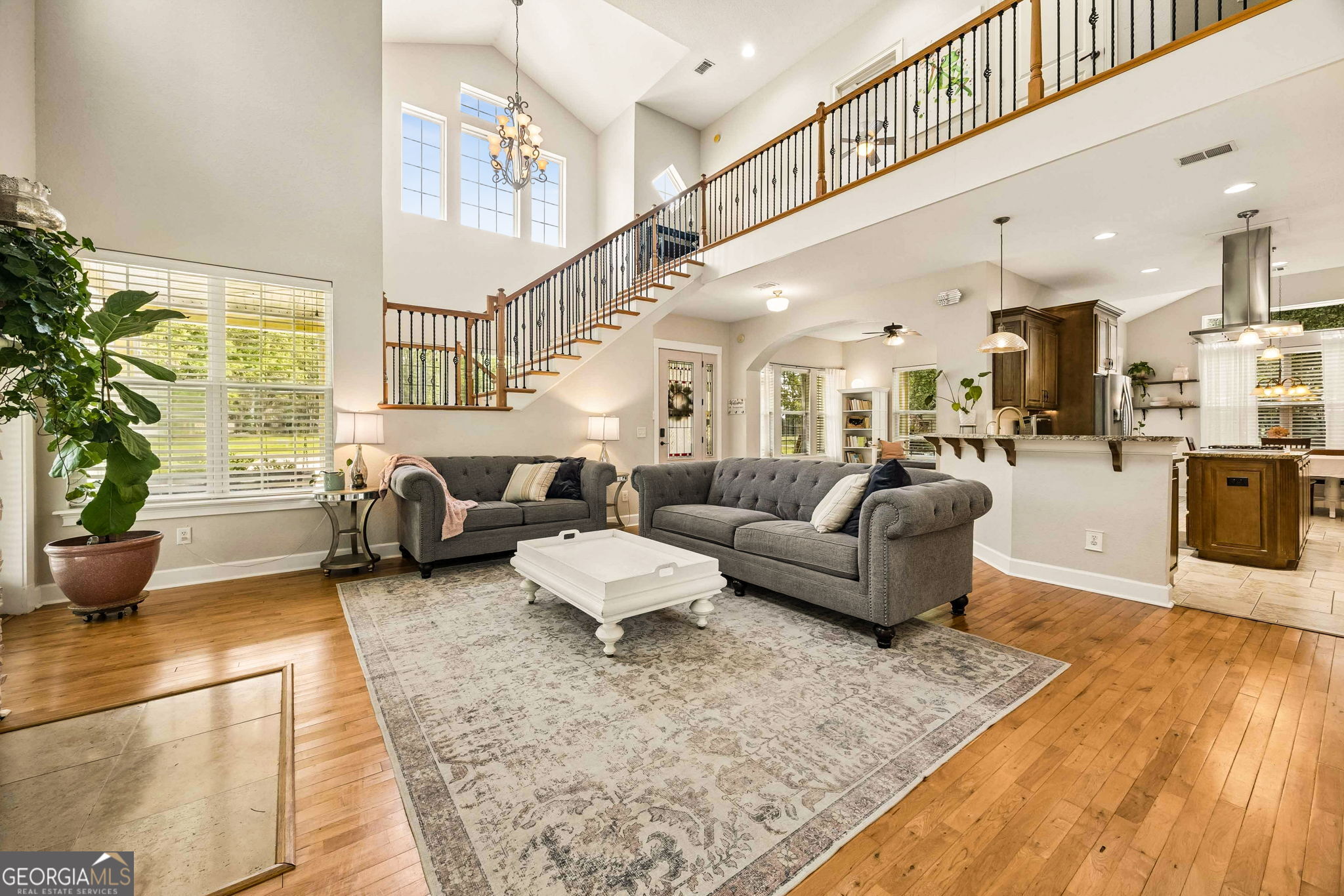 706 Hopewell Point Road White Oak, GA 31568 - Photo 7 of 84 The spacious great room flows seamlessly into the kitchen while the second-floor balcony overlook enhances the home's open and airy design.