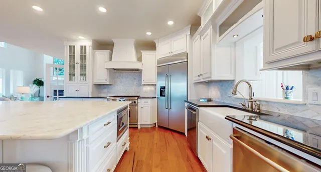 a bathroom with a toilet a sink and a window