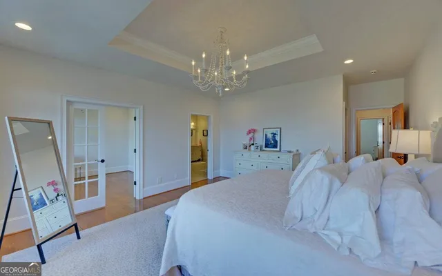 a bedroom with a bed and a ceiling fan