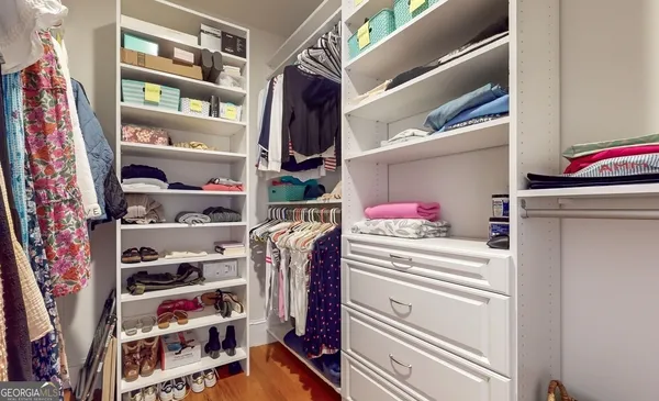 a bathroom with a sink a bathtub and a mirror