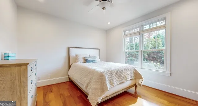 a view of a house with a yard and potted plants