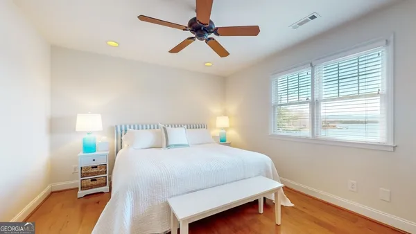 a aerial view of a house with a yard and lake view