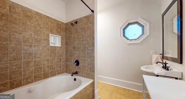 an aerial view of a house with a yard and garden