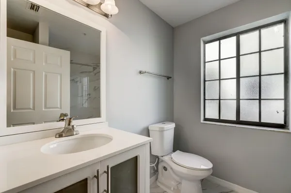 a bathroom with a sink and a toilet