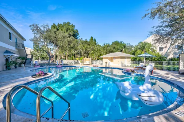 a view of a swimming pool with a patio