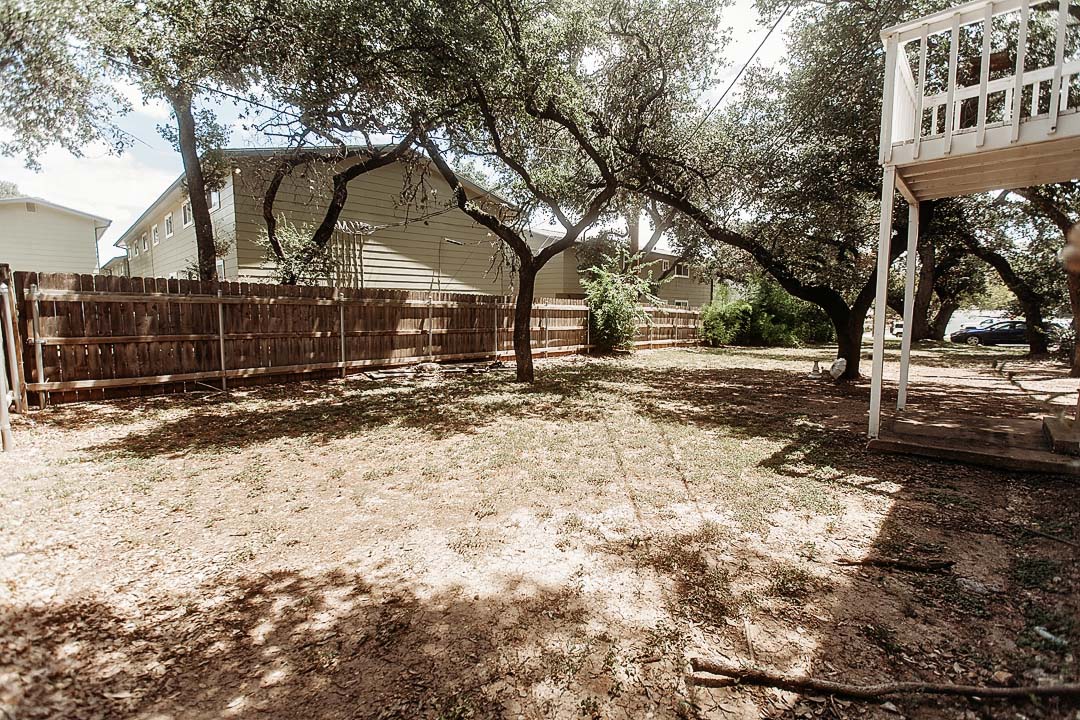 3712 Menchaca Road, Unit 7 Austin, TX 78704 - Photo 11 of 13 Mature shade trees and a privacy fence define this level outdoor space.