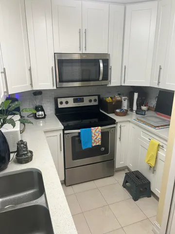 a kitchen with a stove and a microwave