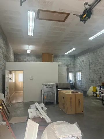 a kitchen with a sink appliances and cabinets