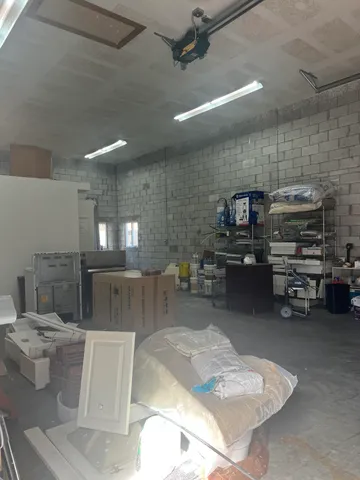 a room with lots of furniture and clutter