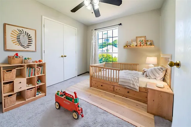 a bedroom with furniture and a window