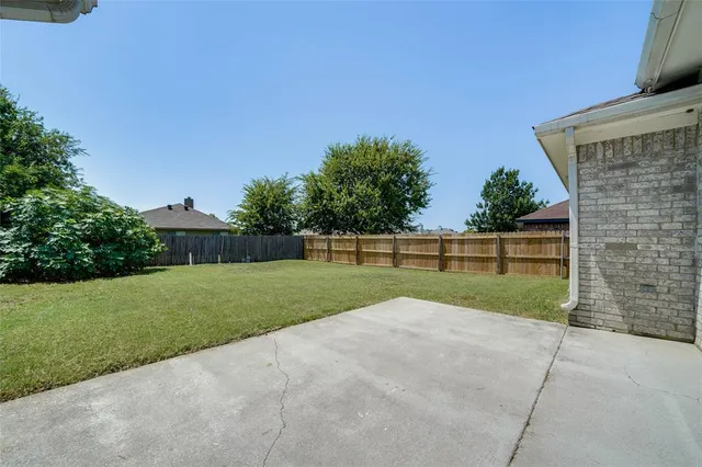 a view of backyard with green space
