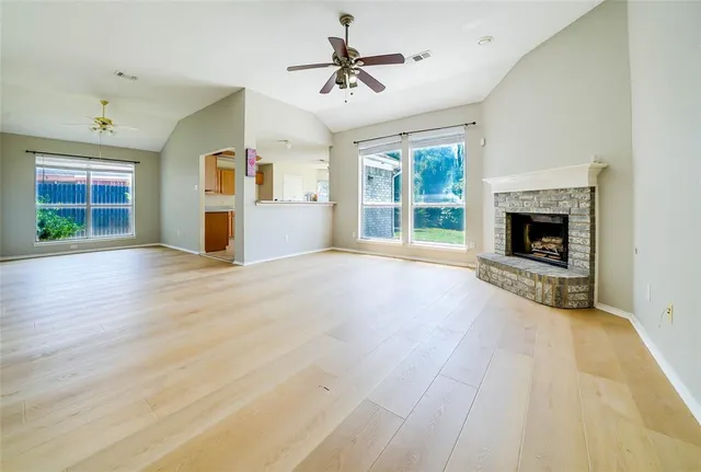 a view of livingroom and window with fireplace
