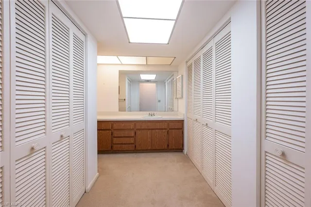 a bathroom with a granite countertop sink mirror and a