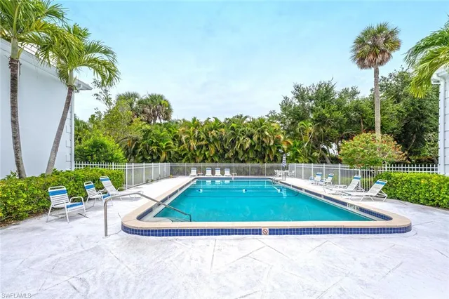 a view of a swimming pool with a yard