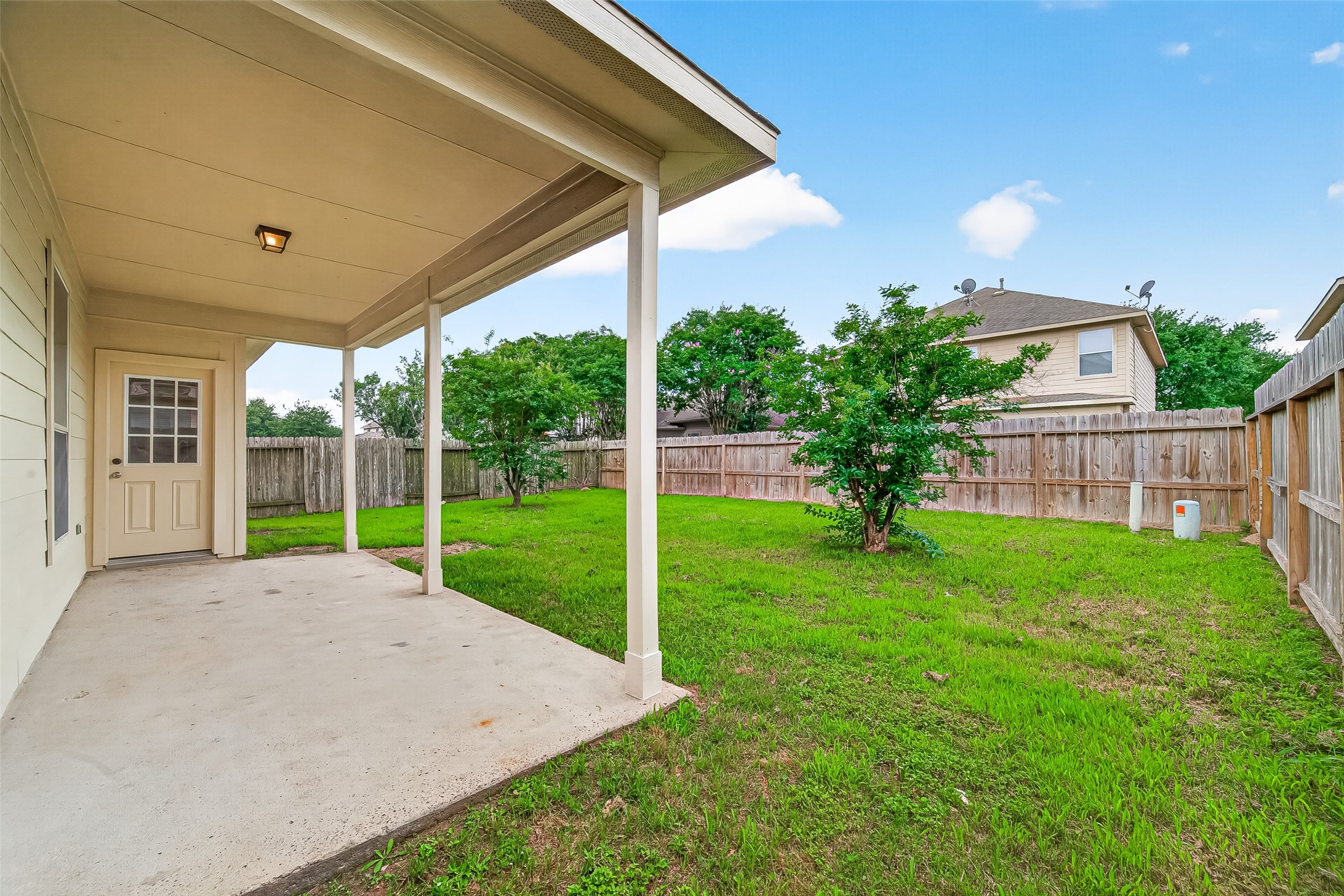 21327 Bella Flora Court Spring, TX 77379 - Photo 47 of 50 a view of a house with backyard and porch