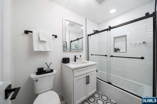 141 Park Avenue, Unit 8A East Rutherford, NJ 07073 - Photo 16 of 22 a bathroom with a granite countertop sink toilet and shower