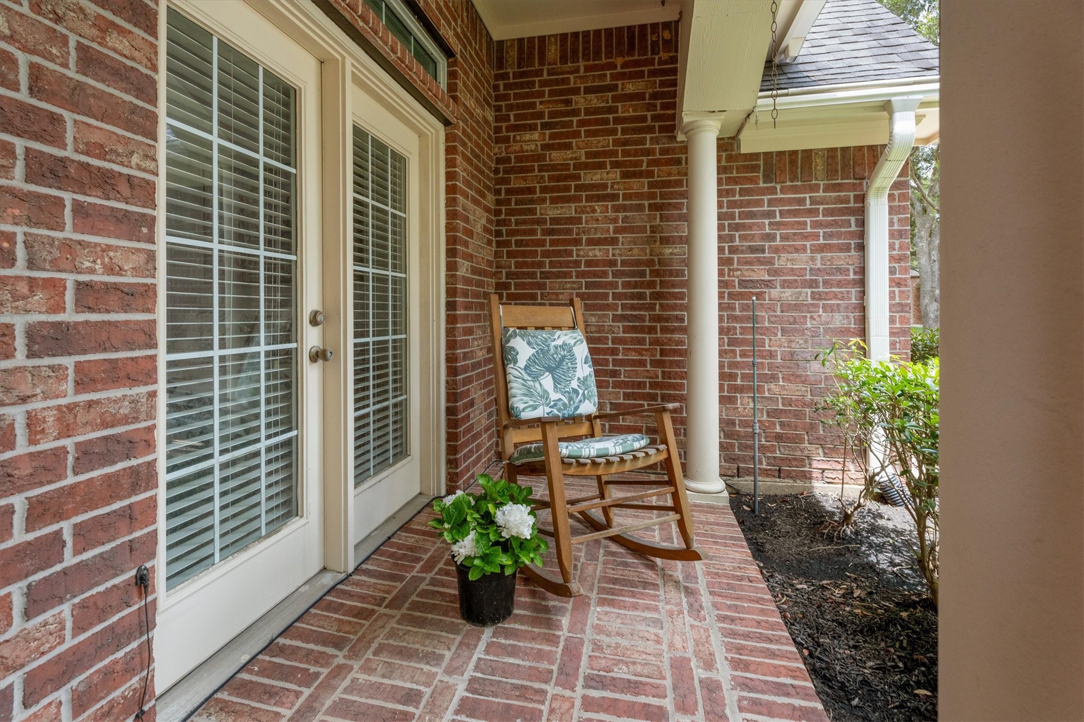 9406 Lochflora Drive Spring, TX 77379 - Photo 5 of 49 a view of a door with a potted plant