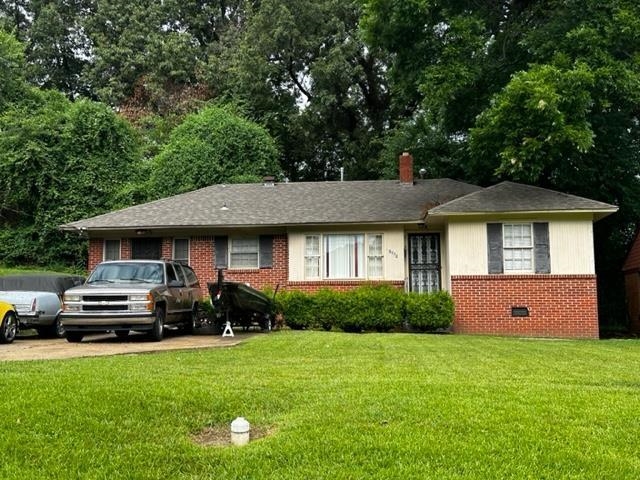 1309 Semmes Street Memphis, TN 38111 - Photo 1 of 1 a front view of a house with a garden