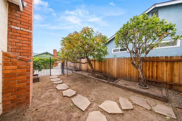 a view of a backyard of the house