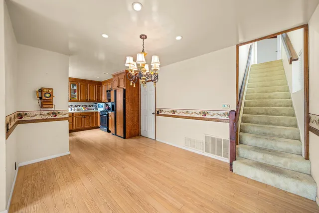 a view of kitchen with cabinets and wooden floor