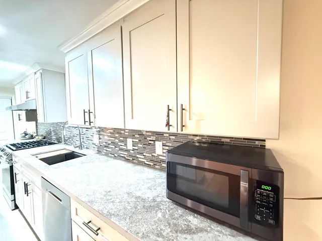 a kitchen with a stove and a sink