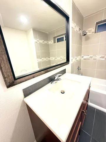 a bathroom with a sink and a mirror