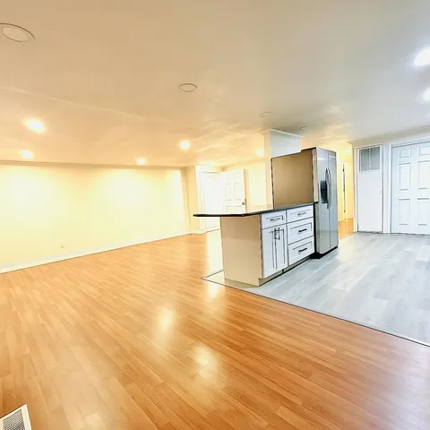 a view of a kitchen with wooden floor