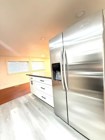a view of kitchen and wooden floor